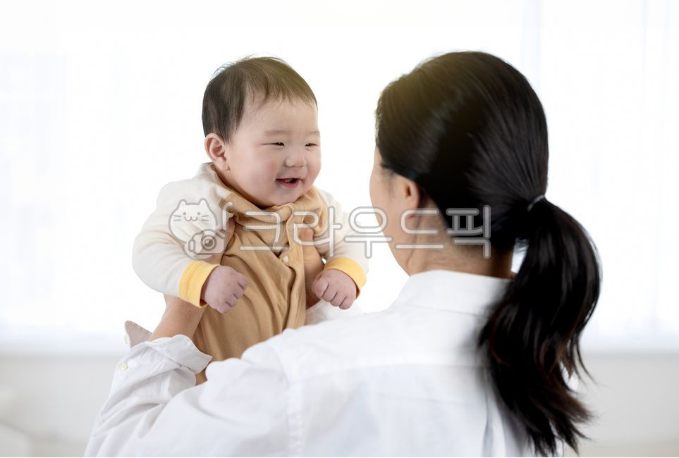 love,two people,backlight,bright,facing,white background,mom,maternal love,infant,inside,house,smile,son,happiness,children,lifting,living room,by the window,parenting,hugging,smiling,Happy,portrait,reconciliation,home,face,baby,family,curtain,child