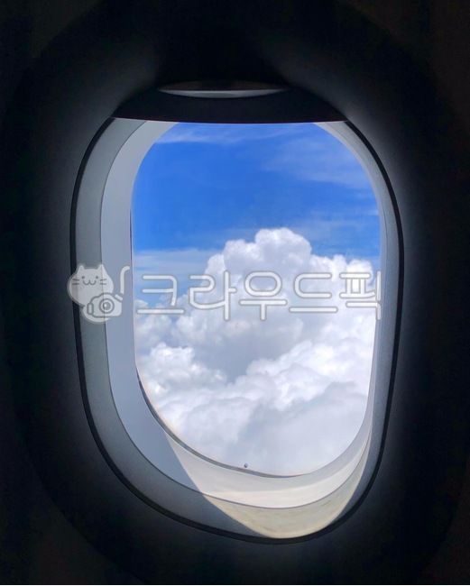 sky,cloud,airplane,puffy clouds,window,travel