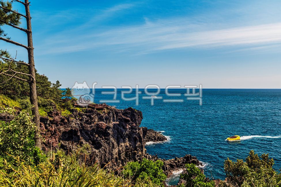 sky,cliff,nature,tourist destination,tree,ship,famous place,water,boat,sea,cloud,outdoor,horizon,promontory,Seogwipo,columnar jointing,Jeju Island,volcanic area,Daepo columnar jointing,cape