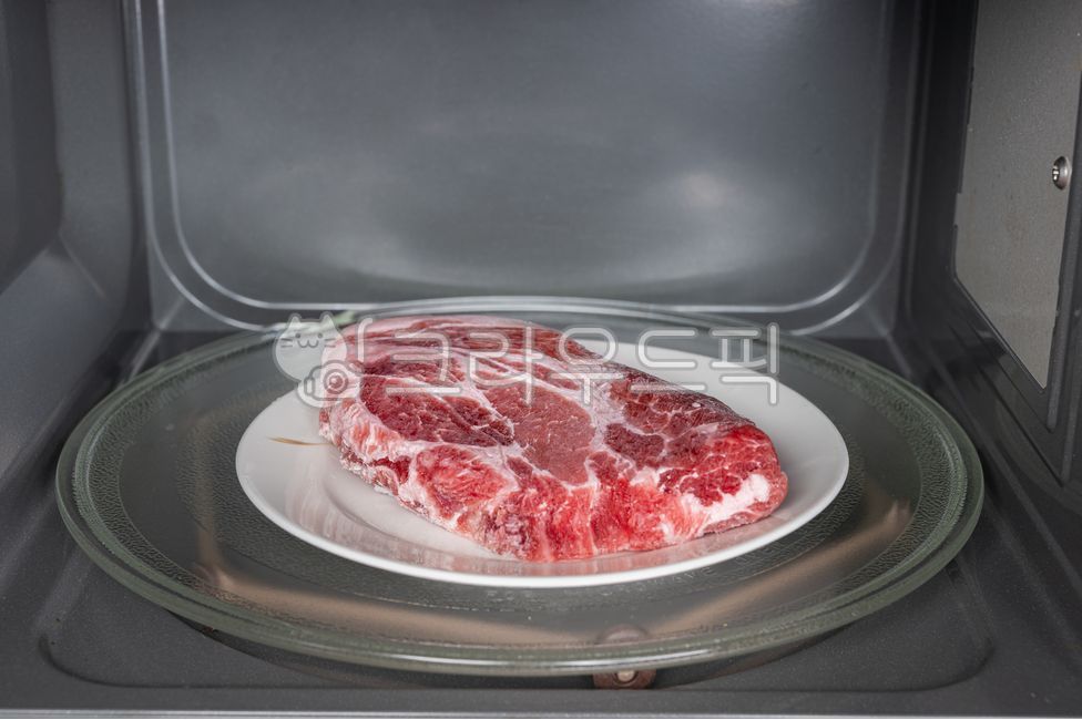 microwave,oven,interior,kitchenware,kitchen,kitchenware,dish,fresh,electric,range,pork,defrost,frozen meat,meat,meat,food,pork,steak,fresh,cooking,raw meat,frozen food