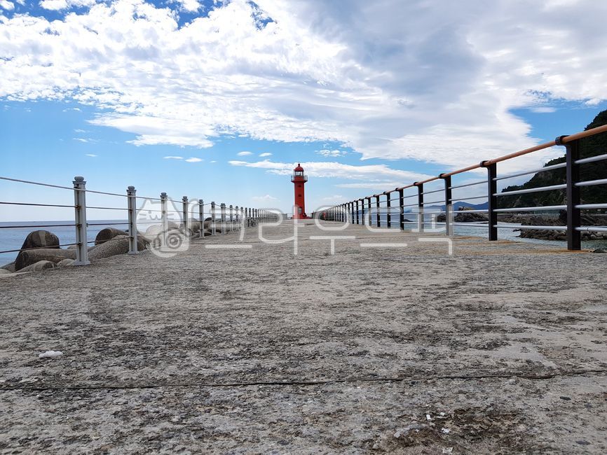 sky,railing,red lighthouse,bridge,sea,Gangneung