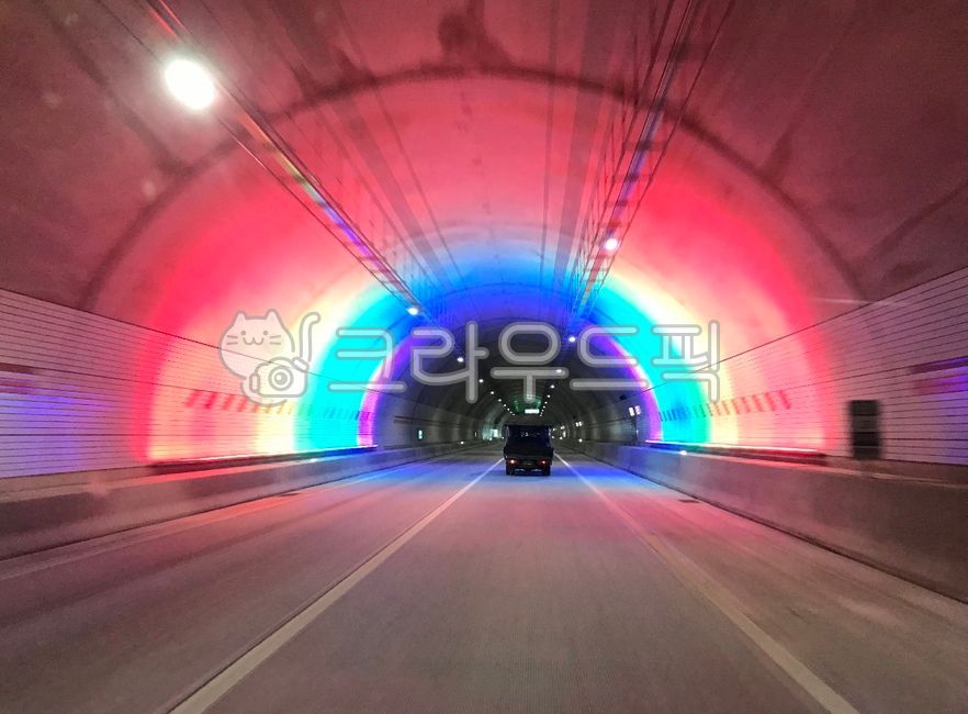 speeding,truck,asphalt,outdoor,outdoors,road,car,highway,tunnel,lights