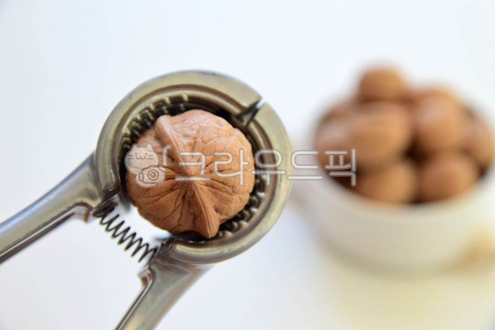 nutcracker machine,Walnut hammer,Fruit,Peanuts,savory,snack,peeled,nut,food,walnut,nutrition,nuts,wellbeing,ingredients,bum,cropped