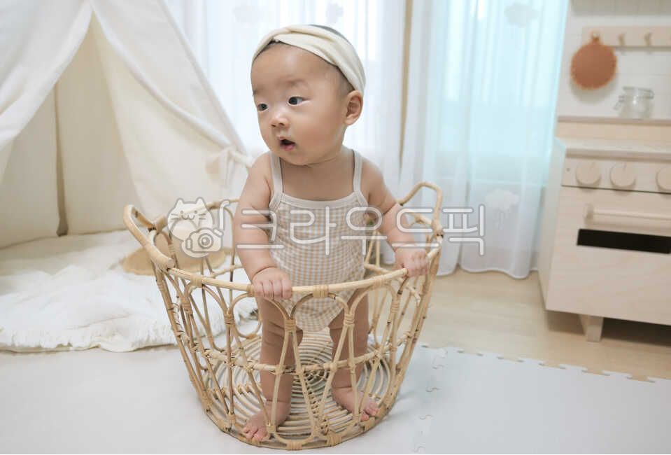 baby model,small,tent,facial expression,rattan basket,rug,young,held,playroom,innocent,0 year old,rattan,Basket,mothers arms,infant,pure,cute,one year old,straw hat,life,interior,son,angelic,hat,baby tent,human,parenting,lovely,precious,newborn,1 year old