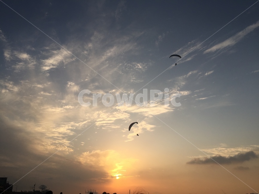 sky,cloud,paragliding,evening glow,ocean,activity,sports,Evening,background,sunset