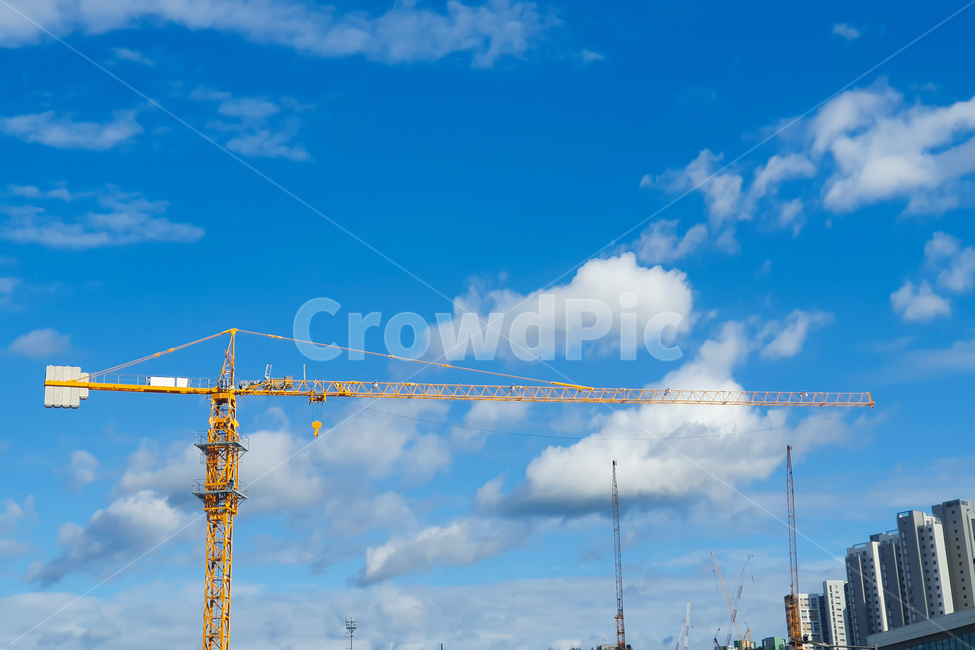 sky,blue sky,crane,business,Foundation construction,yellow,construction site,industry,construction crane,cloud,blue,Construction site,safety,regional development,constructioncrane,Development,tower crane,apartment