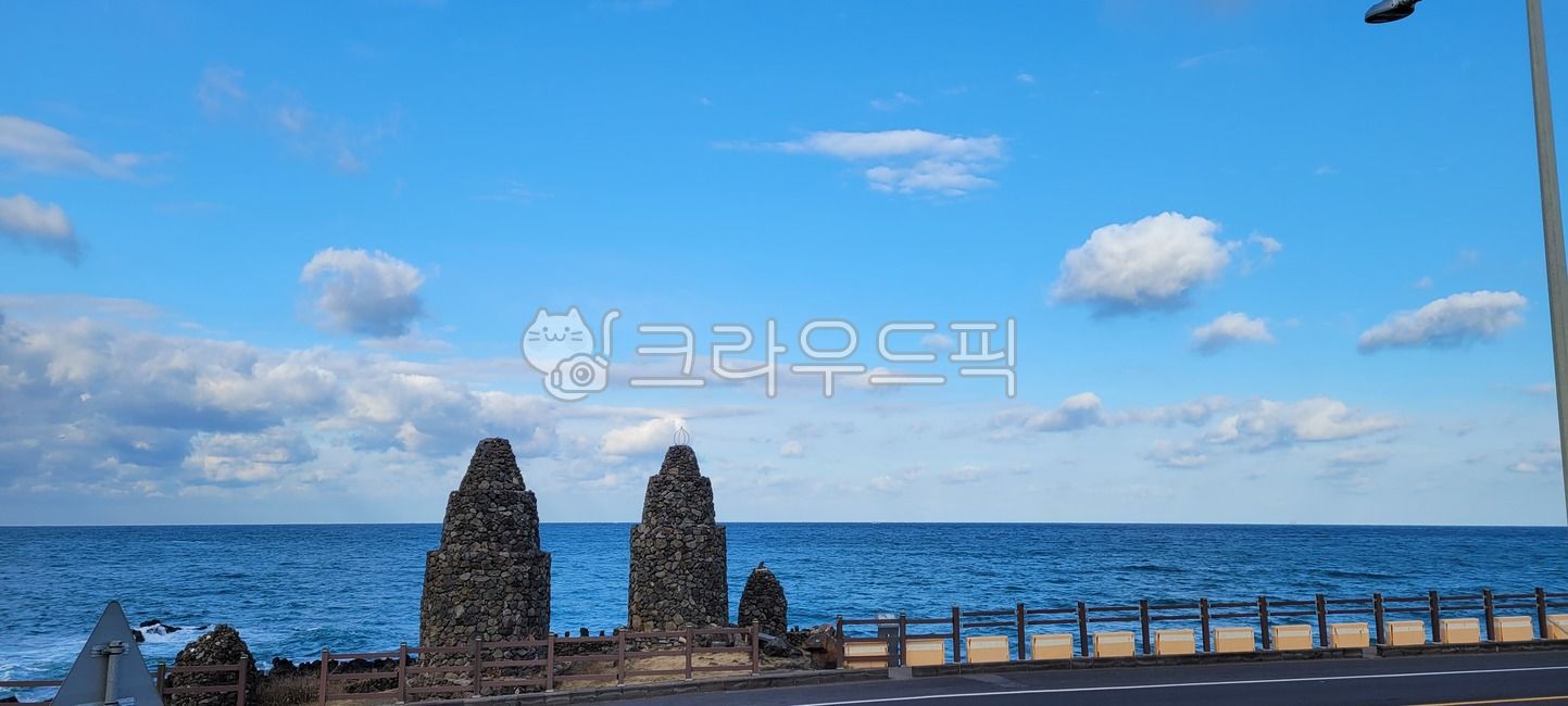 sky,blue sky,coastline,ocean,stone tower,coastal road,jeju island,drive,landscape