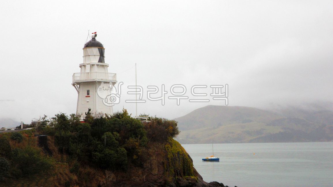 naturallandscape,Overseas,Lighthouse,building,Foreign natural scenery,Overseas natural scenery,mountain,mountainouslandforms,highland,sky,tree,overseasnaturallandscape,New Zealand,coast,ocean,newzealand,background,south island,southisland,Hill,lighthouse,