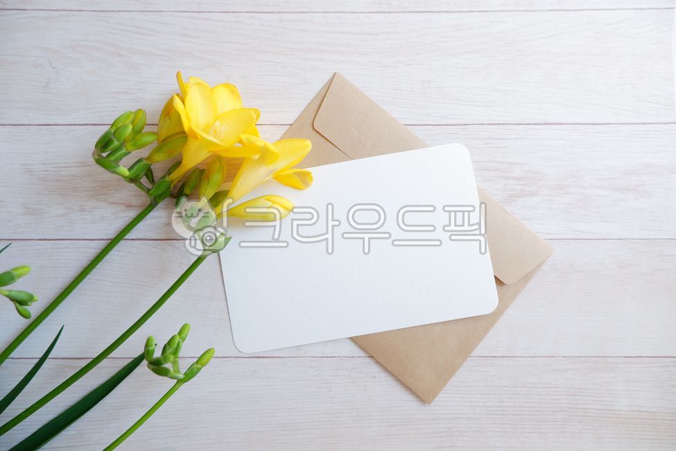 wooden table,Spring background,greeting,yellow,yellow flower,wood background,spring,spring flowers,Postcard,freesia flower,wood,woodentable,freesia,floral,green,flower,envelope,writing pad,plant,letter,card