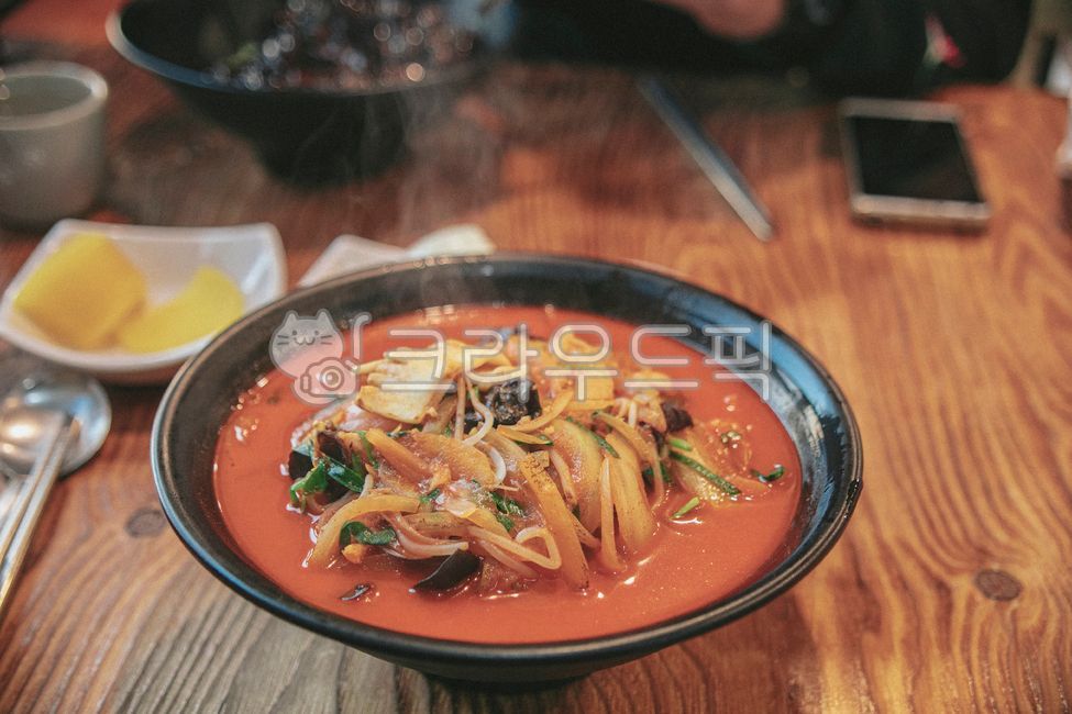 noodle dish,soup,noodles,dining table,chopsticks,pickled radish,Chinese food,bowl,food,meal,dish,person,spoon,Jjamppong,table