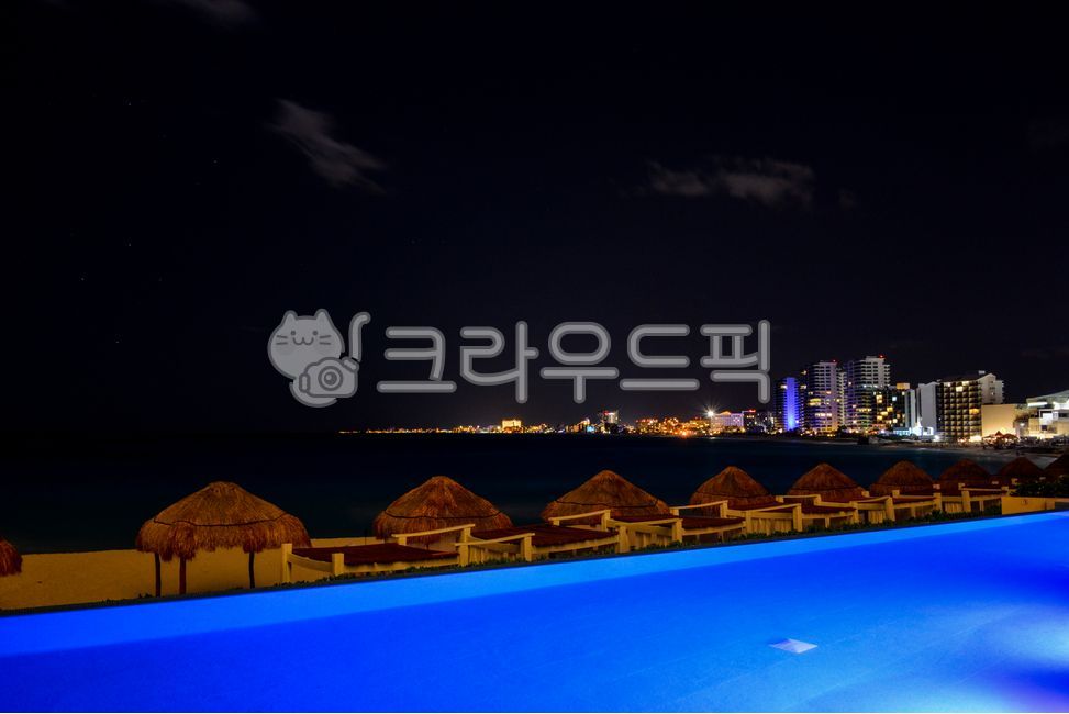 night view,bungalow,hut,building,Beach,ocean,outdoors,light,cancun,swimming pool,sandy beach,Mexico,hotel