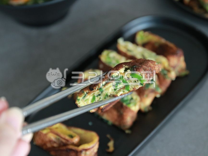 side dish,chopsticks,Korean,cooking,egg roll,food