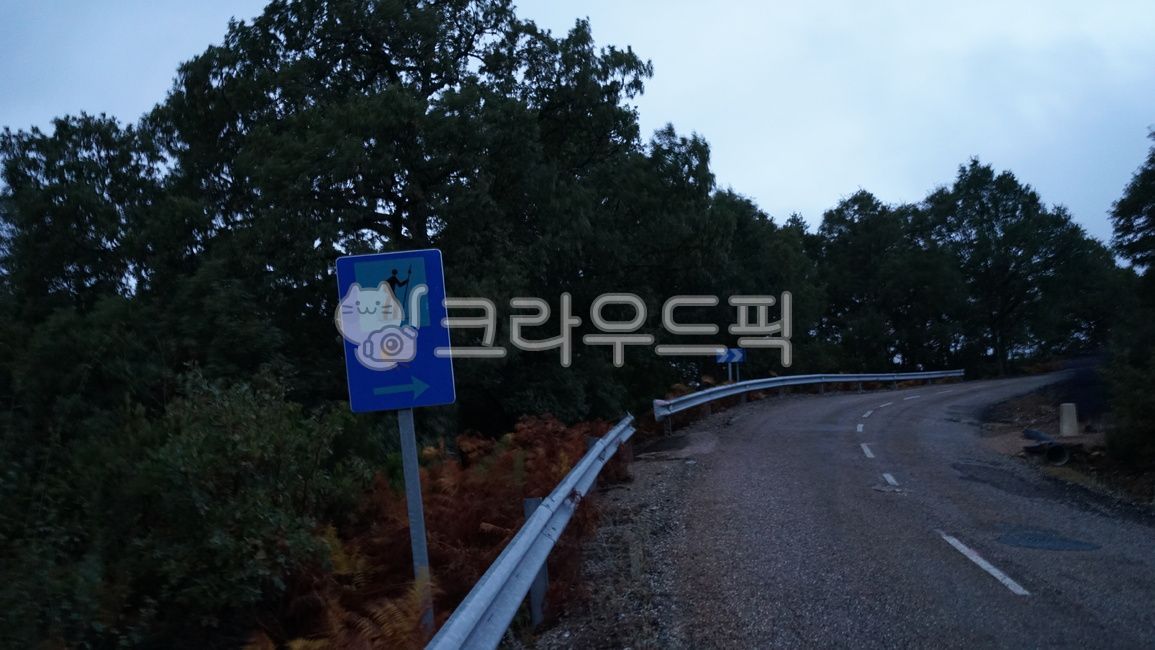 uphill road,milestone,pilgrim path,santiago,road name,dawn