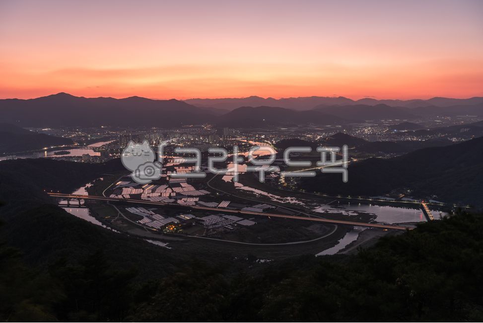 sunset,evening glow,evening sky,provincial city,highway,road,waterway,river,river water,city,night view,night,evening,greenhouse,farming,agriculture,light,lights,road,field,building,architecture,apartment,house,bridge,bridge pier,