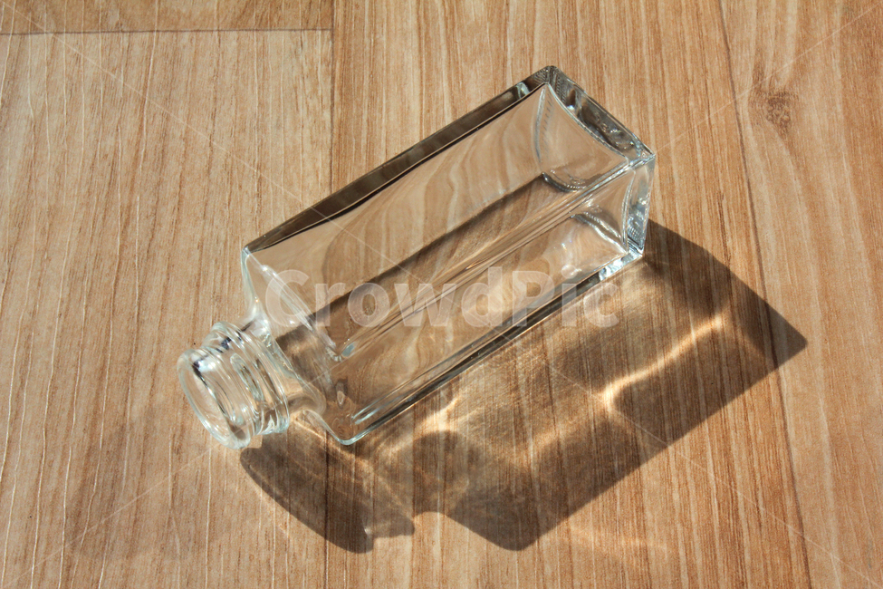 glass,wooden floor,empty bottle,glass bottle,recycling,opened,bottle,clean,empty,square,open