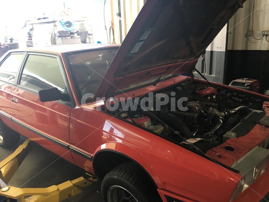 red car,bonnet,machine,Australian repair shop,repair shop,old car