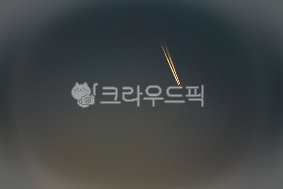 sky,flight,outdoors,airplane,airplane clouds,evening sky