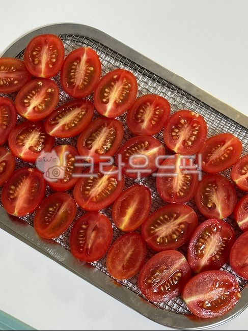 Cherry tomatoes,cherry tomato cross section,sun-dried tomatoes,soil,tomatoes
