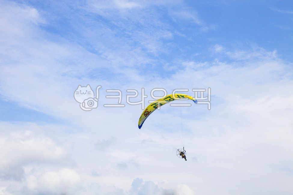 sky,blue sky,gliding,work out,sports,transportation,cloud,parachute,paragliding,blue,background,sight,leisure,traffic