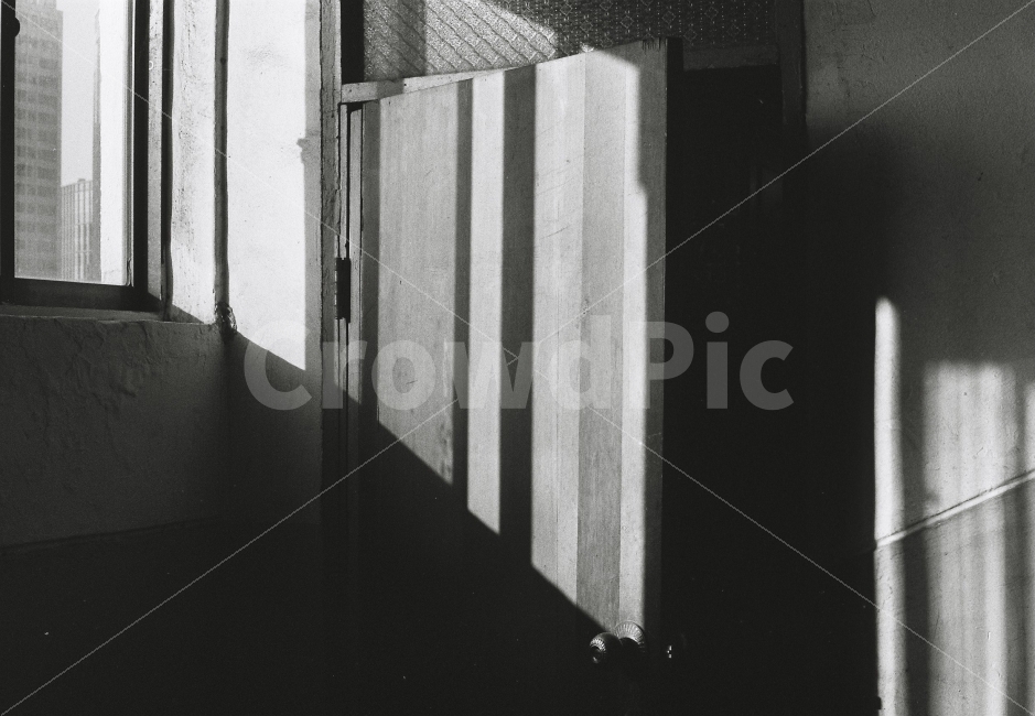 door,shadow,light,black and white film photography,Grayscale