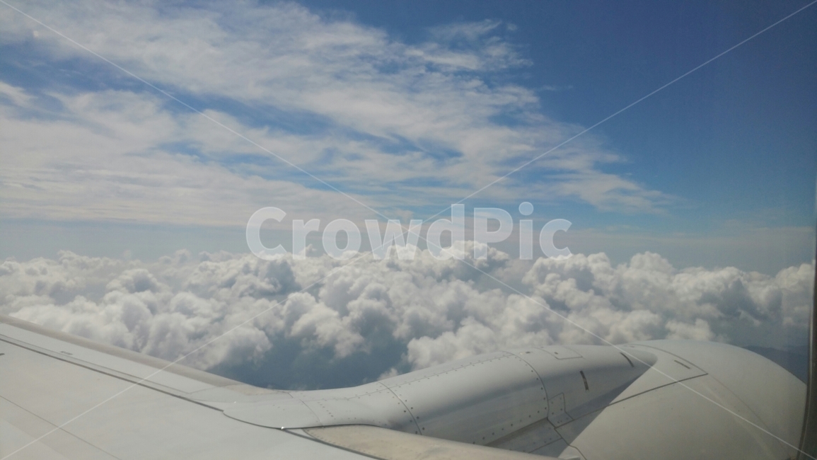 sky,blue sky,nature,outside the plane,cloud,healing,background,airplane,above the clouds,sight,weather,puffy clouds,Sunny
