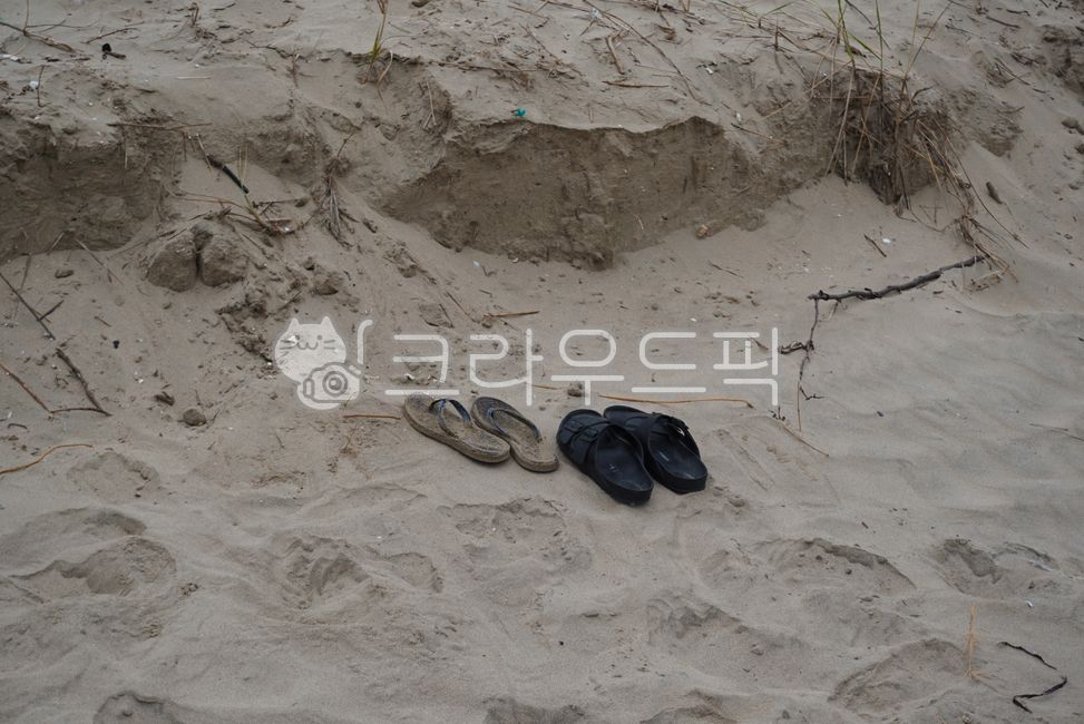 footwear,sandal,shoes,clothes,sand,Beach,ocean,sandy beach,clothing,shoe