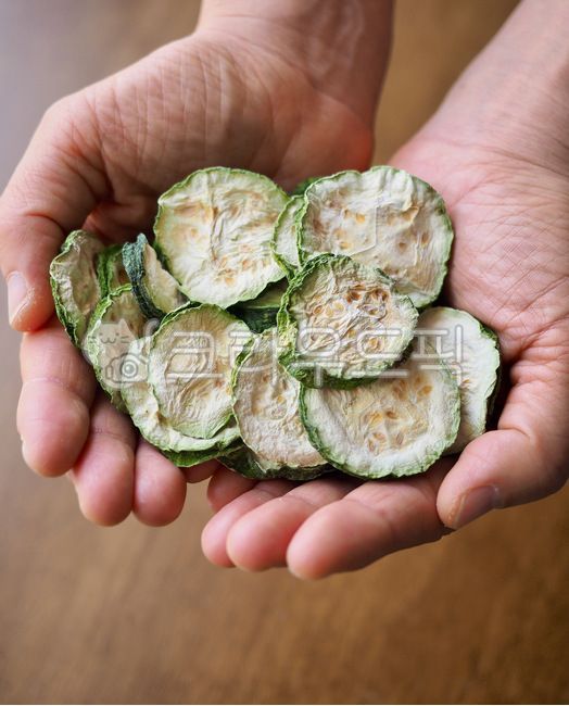 cookingingredients,vegetable,dried zucchini,agriculture,squash,dryfood,dry food,Agriculture,organic,hand,human hand,green,dry,cooking ingredients,food,naturalfood,background,plant,driedzucchini,fresh,pumpkin,natural food