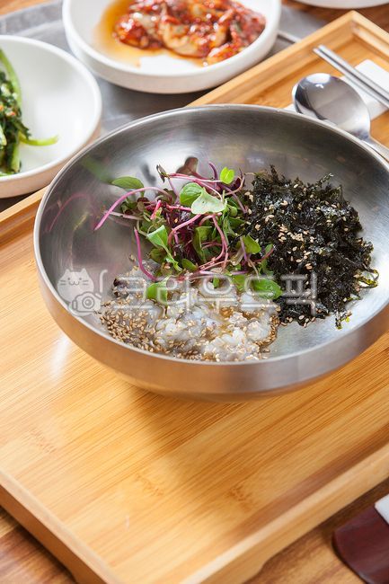 tray,local food,octopus,bibimbap,octopus soup,wooden tray,vegetables,delicious restaurant,bamboo tray,wild octopus,spoon rest,wild octopus bibimbap,healthy food,Korean food,spoon,nutritious food,sprouts,raw octopus,Octopus bibimbap,octopus dishes,seafood,