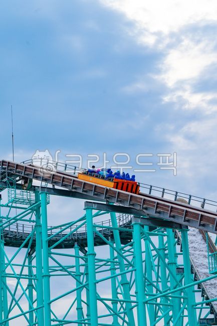 roller coaster,orange till,amusement park,bridge,building