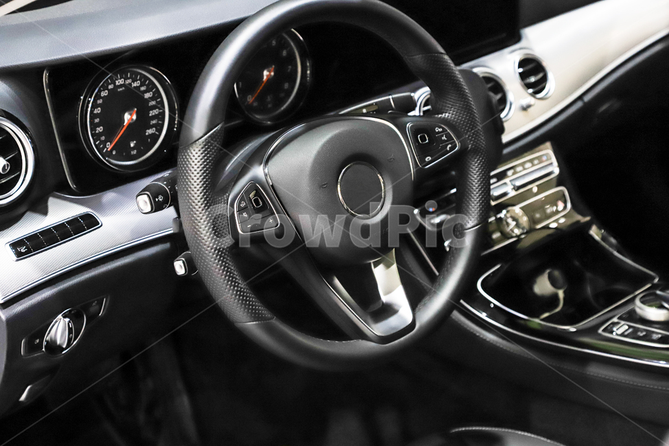 drivers seat,pedal,curve,air vent,handle,industry,leather,button,science,luxury,circle,airbag,dashboard,gear,traffic