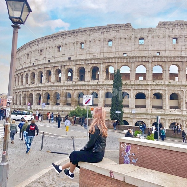 city,down,Colosseum,womans back,building,pink hair,cloud,human,architecture,bleached hair,sky,downtown,travel to italy,urban,person,Italy,rider jacket,colosseo
