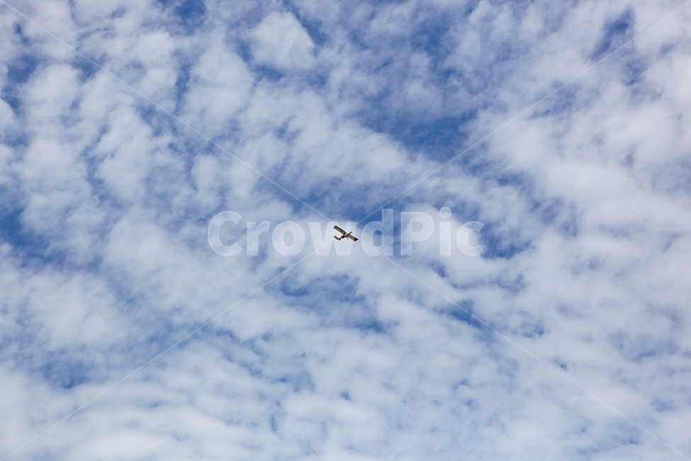 cloud,sky,blue sky,nature,airplane,light aircraft,sight,wing