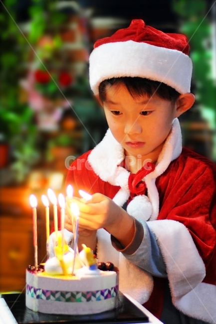 Candlelight,santa costume,kid,Santa Claus,Christmas cake,boy,christmas,Christmas Eve,candle,ignition,santa hat,child,xmas