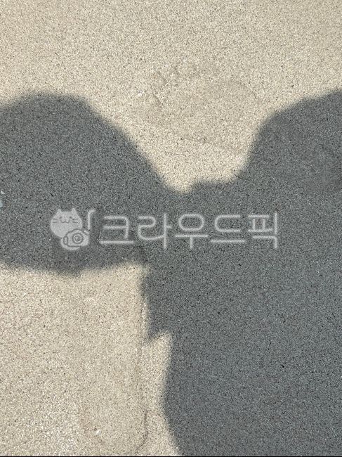 sand,human shadow,shadow,road,road name,person shadow