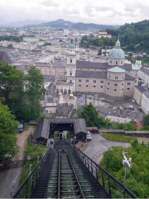 Eastern Europe,city,tourist city,Middle Ages,building,scene,funicular,cloud,mountain train,beautiful,Austria,dark clouds,baroque style,sight,incline,europe,mozart,travel destination,railroad,nature,cable car,rail,Salzburg,medieval city,slope,salzburg,tour
