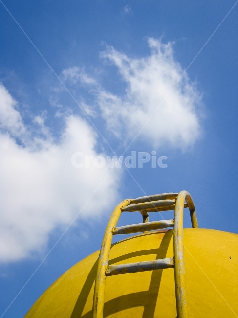 sky,cloud,water tank,ascent,white clouds,stairs,yellow,watertank