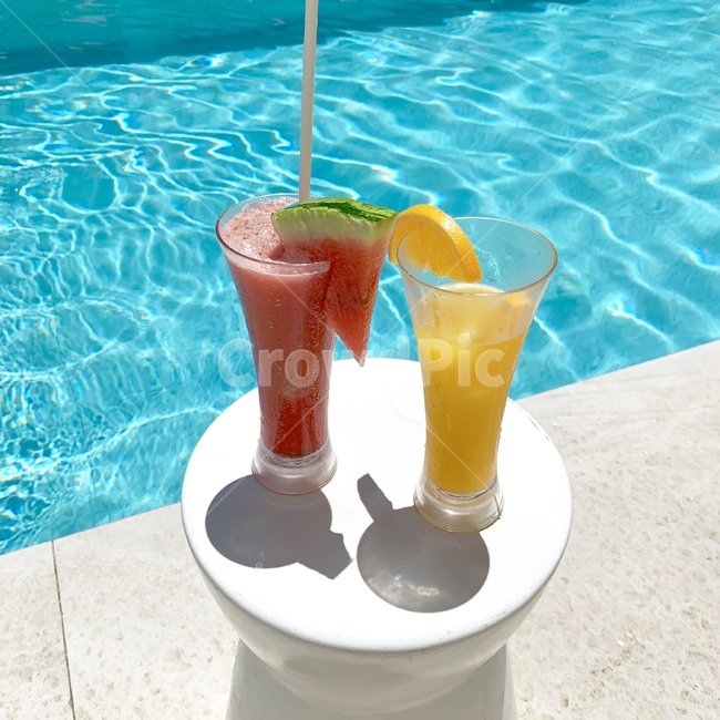 swimming pool,fruit,beverage,recreation,vacation,Fresh fruit juice,watermelon,summer