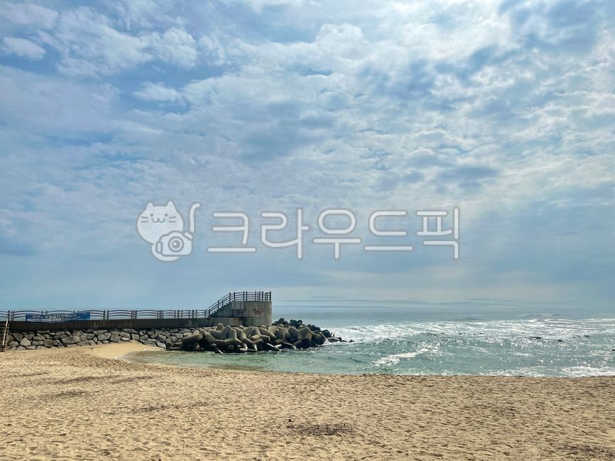 sky,breakwater,nature,coast,Beach,outdoors,ocean,sandy beach,beach,shoreline