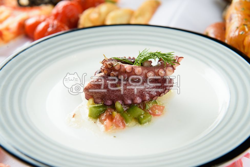 salad,octopus,herbs,octopus legs,appetizer,vegetables,sauce,healthy,delicious,protein,sour,decorated,restaurant,food,meal
