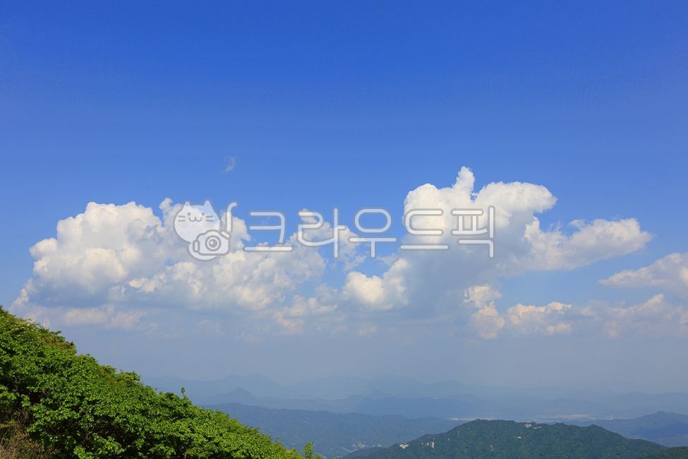 blue sky,forest,clouds,scenery,cloud,beautiful,mountain,view,high mountain,sight,sky,green,nature,clear sky,white clouds,tree,nice weather,blue,outdoors,background,alpine,landscape