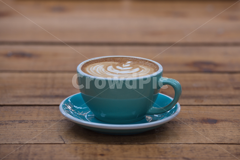 latte art,pattern,barista,Coffee,cafeteria,latte,coffee beans,cafe latte,tea,leaves,coffee cup,beverage,copy space,scent,wood,table,art,shape,coffee shop,milk,brown,food,cafe,dessert,closeup,background,fresh,sweet,cup,object